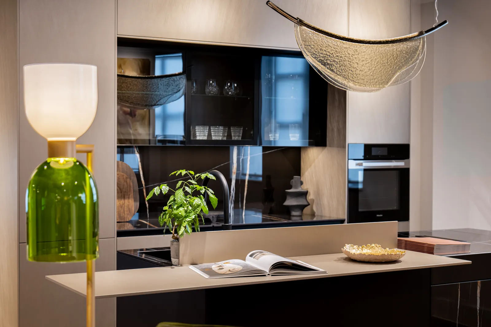 Kitchen island with seating, pendant lighting and integrated cabinetry