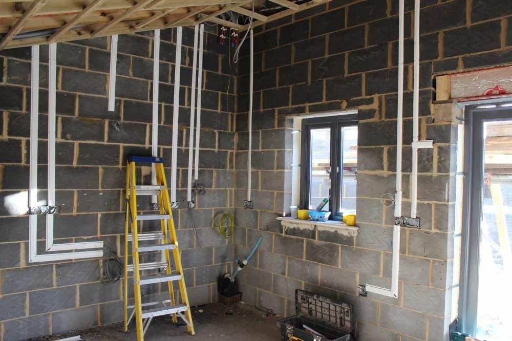 Exposed blockwork and timber framing during kitchen first-fix work