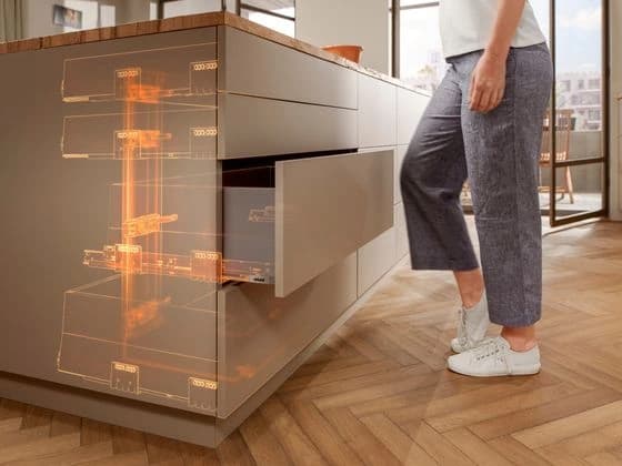 Open kitchen drawer with an illuminated mechanism graphic