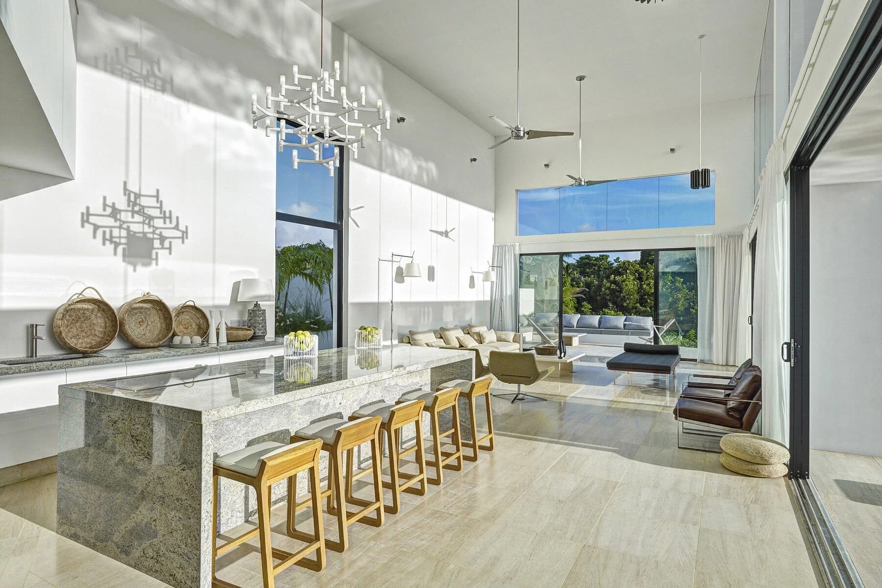 Open kitchen and dining room with a large island and garden view