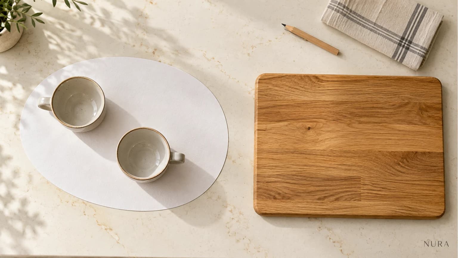 Illustration of an oval paper tray template with two cups beside a separate chopping board on an ivory worktop