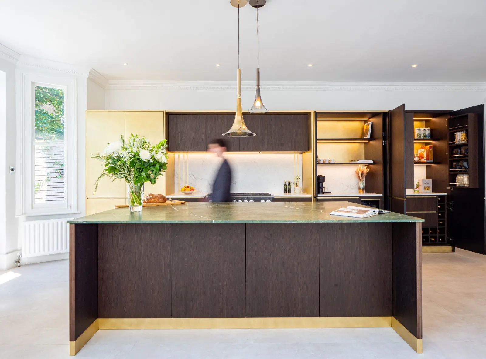 Light-filled kitchen with a central island, timber cabinetry and open shelving