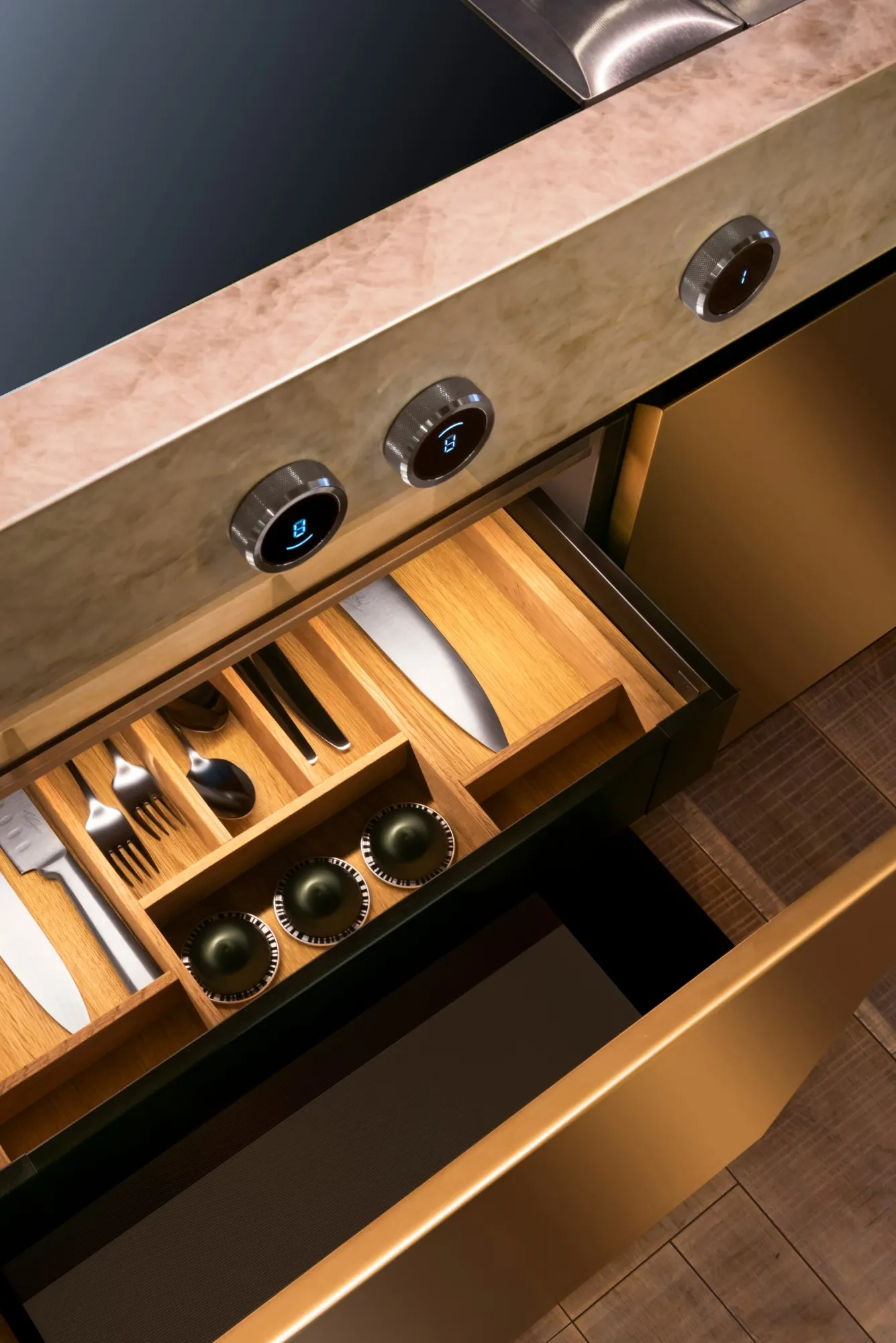 Ribbed timber kitchen cabinetry with green stone sink and window light